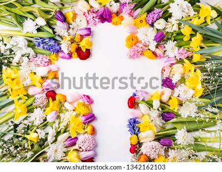 Flowers and cross Easter abstract concept on a white background. Copy space.