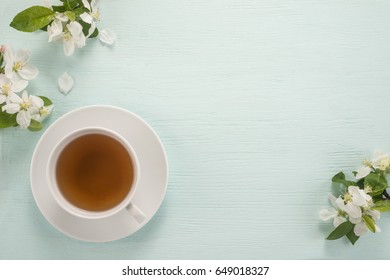 Flowers and cup of tea  - Powered by Shutterstock