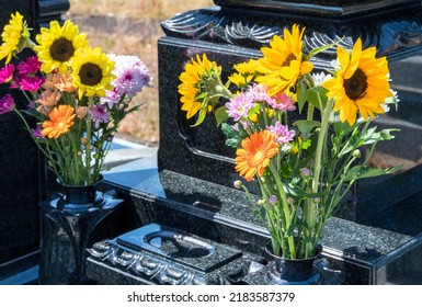 Flowers displayed in flower stands and Japanese graves. - Shutterstock ID 2183587379