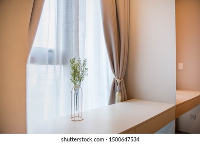 Flowers in front of window