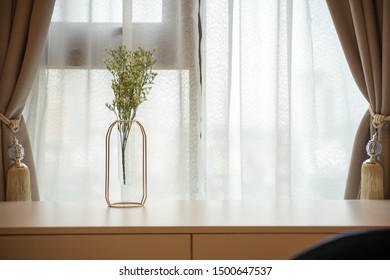 Flowers in front of window
