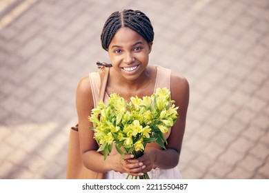 Flowers, Gift And Black Woman With Smile For Bouquet For Birthday Or Celebration In The Street From Above. Face Of An African Girl With A Present Of Yellow Lilies In The Road And The City Of France