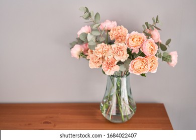 Flowers In Glass Vase On Wooden Table. Fresh Cut Flowers For Decoration Home. Delivery Flower.