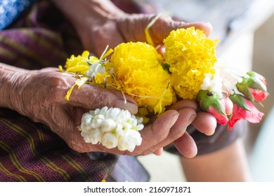 Flowers In Hand Showing Respect.