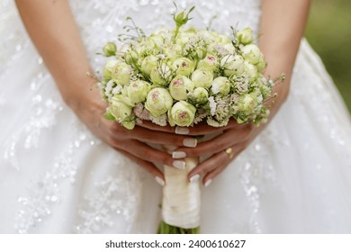 Flowers in the hands of the bride