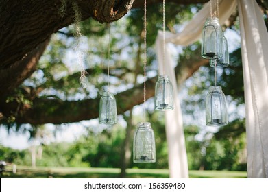 Flowers, lanterns, cloth hanging from a large oak tree in Florida. - Powered by Shutterstock