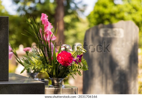 Flowers\
offered to the grave when visiting the\
grave