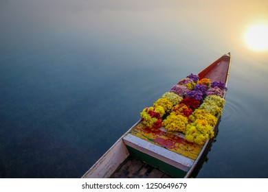 Flowers on boat at floating market, left space for text