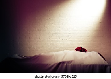 Flowers On The Covered Dead Body In The Morgue