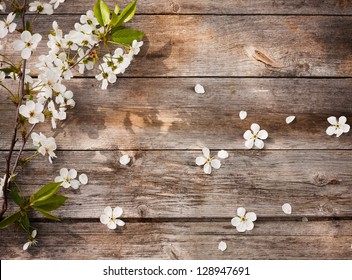 flowers on wooden background - Shutterstock ID 128947691