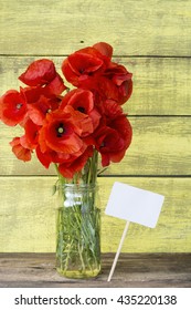 flowers poppy bouquet. fresh strawberries in a pot, and a note for  text. Fresh chilli peppers as a decor. concept for invitations, greetings, birthday, party, date