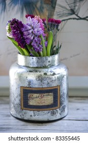flowers in silver cans