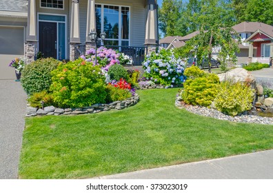 Flowers And Stones In Front Of The House, Front Yard. Landscape Design.