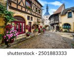 Flowers and traditional medieval stone houses in Bourbon-Lancy historical Old town, Burgundy, France