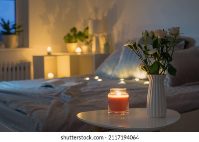 flowers in vase in bedroom in evening