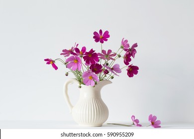 Flowers In A Vase On White Background
