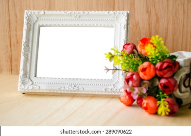 Flowers Vase And Vintage White Picture Frame On Wooden Desktop, Clipping Path