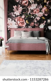 Flowers Wallpaper In Feminine Pink Bedroom Interior With Grey Pillows On Bed. Real Photo