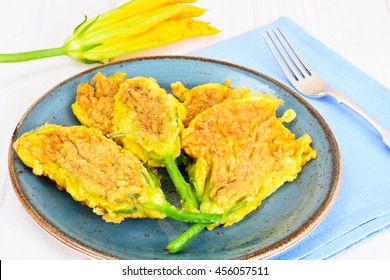 Flowers of Zucchini, Fried in Batter on a Wooden Background Studio Photo