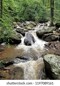Flowing stream with small waterfall