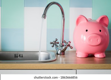 Flowing tap water and a piggy bank standing next to it. Water consumption price concept