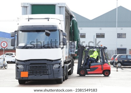 FLT Counterbalance driver loading lorry