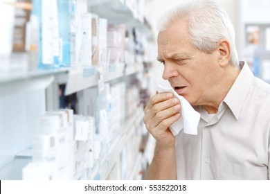 Flu Is Getting To Him. Senior Man Coughing Having A Cold Shopping Medicine At The Pharmacy Copyspace Cold Sickness Health Issues Cough Sore Throat Seasonal Concept