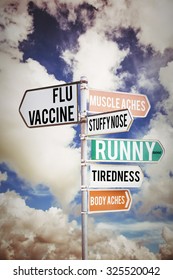 Flu Shots Against Multi Colored Sign Posts Against Cloudy Sky