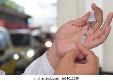 Flu Vaccination In Elderly People Using The Drive Thru System Receive The Vaccine Inside The Car To Prevent Crowding Due To The Coronavirus, Covid19