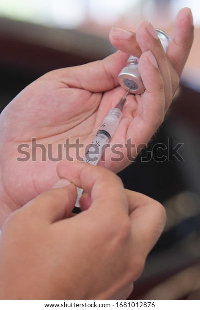 flu vaccination in elderly people\
using the drive thru system receive the vaccine inside the car to\
prevent crowding due to the coronavirus,\
covid19