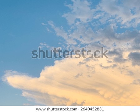 Fluffly white clouds in a blue sky