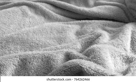 A fluffy blanket background, wrinkled blanket, crumpled blanket