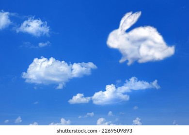 fluffy cloud Easter bunny on a cloudy sky blue background, 