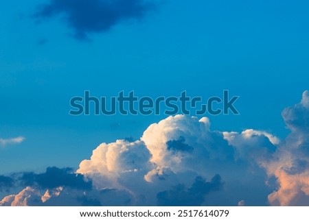 fluffy cloud scape evening low light blue sky simple natural background view