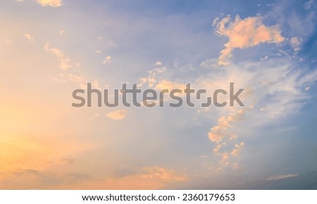 Fluffy Clouds in a Bright Blue Sky: Peaceful and Calm Nature