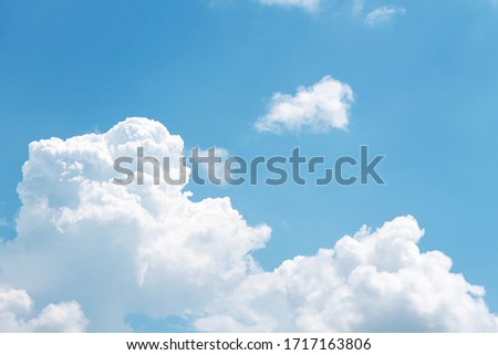 Fluffy clouds patterns on bright bluesky background