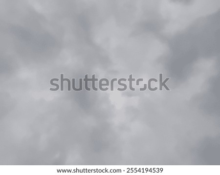 Fluffy dusk and dawn clouds with dramatic cumulus and smoky grey clouds float in the evening sky