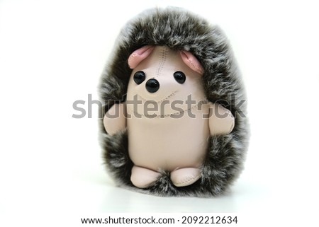Fluffy funny toy hedgehog on white background, isolated