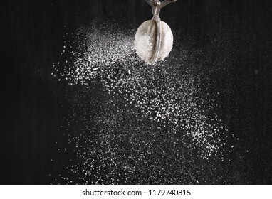 fluffy powdered sugar on black background - Powered by Shutterstock