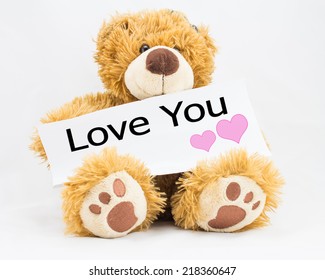 Fluffy Teddy Bear Holding A Sign With The Words 