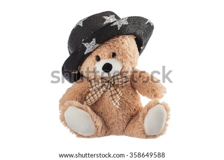 Fluffy teddy bear with party hat isolated on a white background