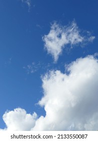 Fluffy White Clouds And Blue Sky Near Wapato Point In Manson, Washington