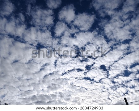 fluffy white clouds in the blue sky, sunnyday and beautiful background