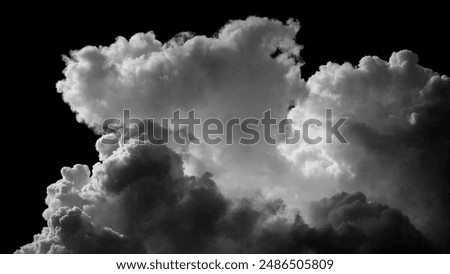 Fluffy white clouds drift on a black background