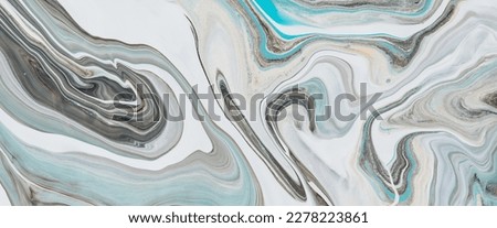 Fluid art background with light blue tints on white stony surface. Liquid ink marble imitation. Marbling effect of acrylic paints on canvas. Abstract marble texture with mixing colors. Modern interior