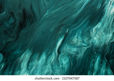Fluid Art. Liquid emerald green abstract drips and wave. Marble effect background or texture