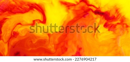 Fluid Art. Liquid red orange colors paint background. Colorful abstract watercolor texture. Liquid art concept