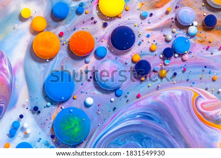 Fluid art texture. Background with abstract mixing paint effect. Liquid acrylic picture with mixed paints and bubbless. Can be used for background or poster. Multicolor overflowing colors.