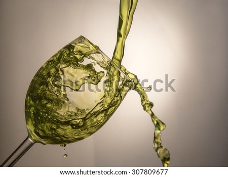 Fluid motion of coloured water in a wine glass 