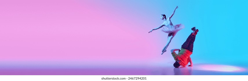 Fluid Motion. Motion of two different worlds of dance, tender girl, ballerina and break dancer dancing on gradient background in neon light. Concept of classical and modern dance, performance. Banner - Powered by Shutterstock